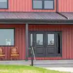Covered porch with seating at the Shooting Club lodge