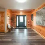 Live-edge wood feature wall inside the Shooting Club